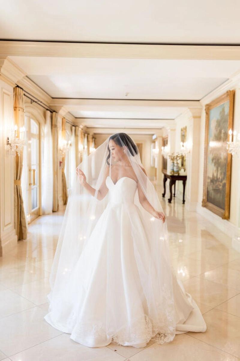 Kelsey Wears Classic Strapless Ball Gown Wedding Dress. Desktop Image