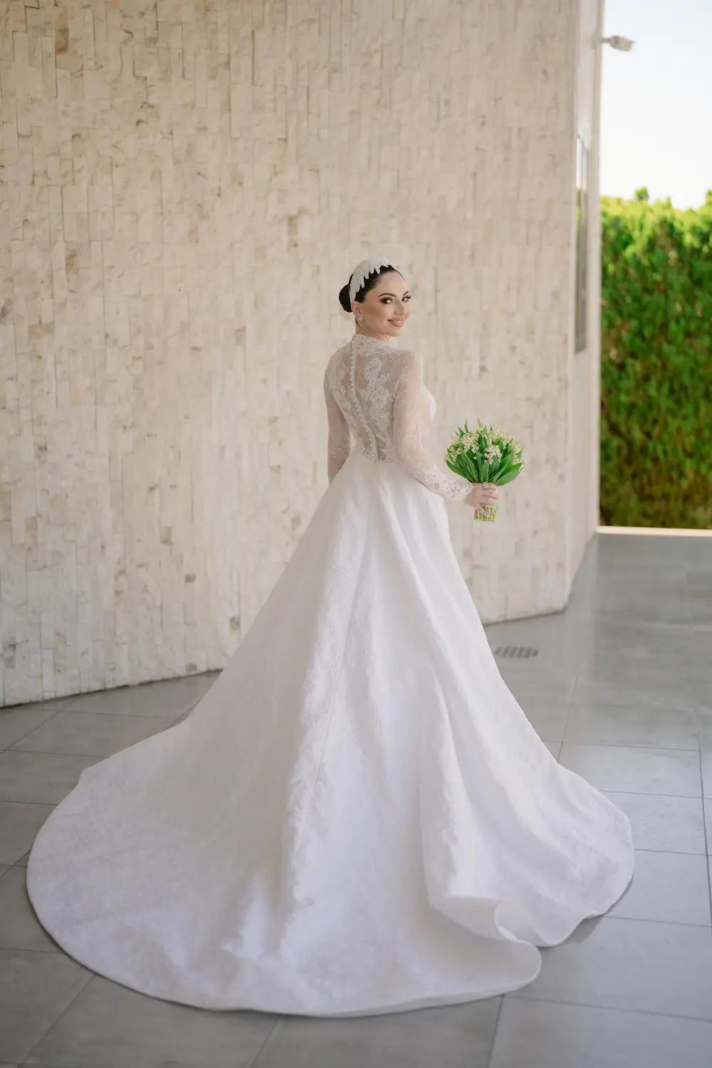 Irina Wears Long Sleeve Lace Ball Gown Wedding Dress. Mobile Image